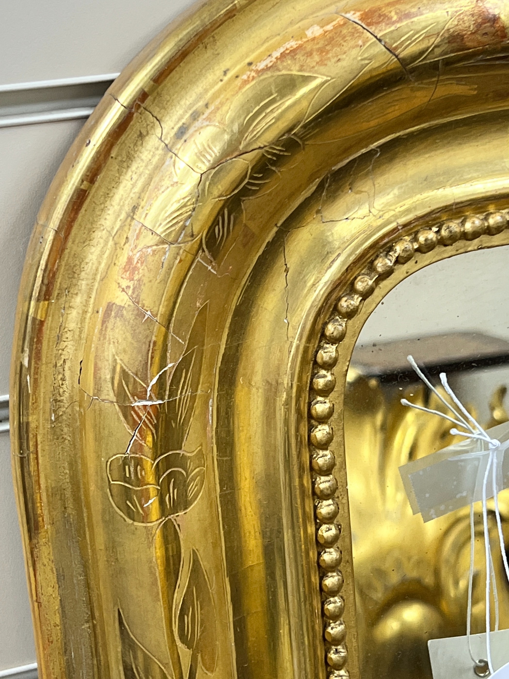 A 19th century French giltwood overmantel mirror, width 100cm, height 141cm